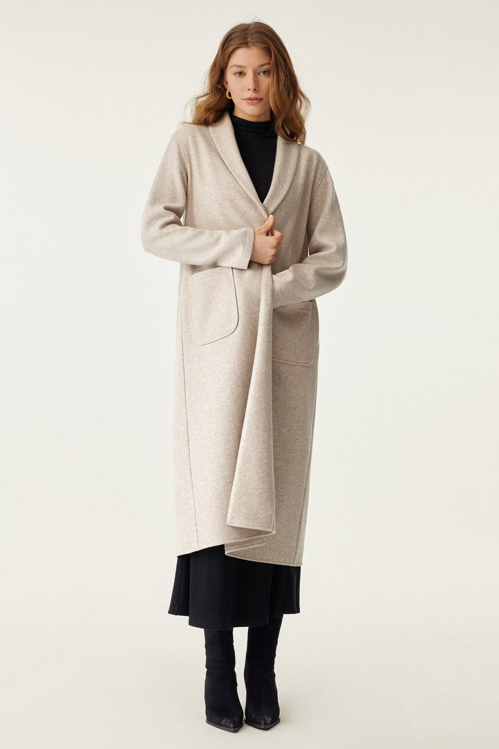 Long coat with applied pockets