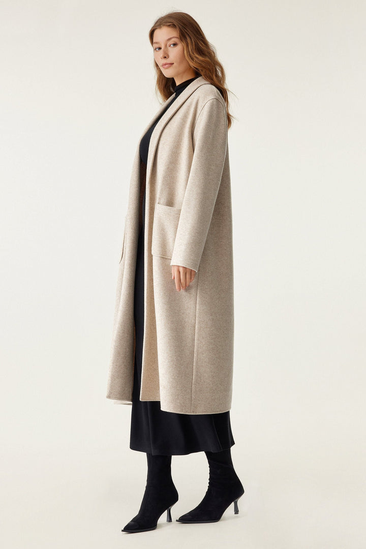 Long coat with applied pockets
