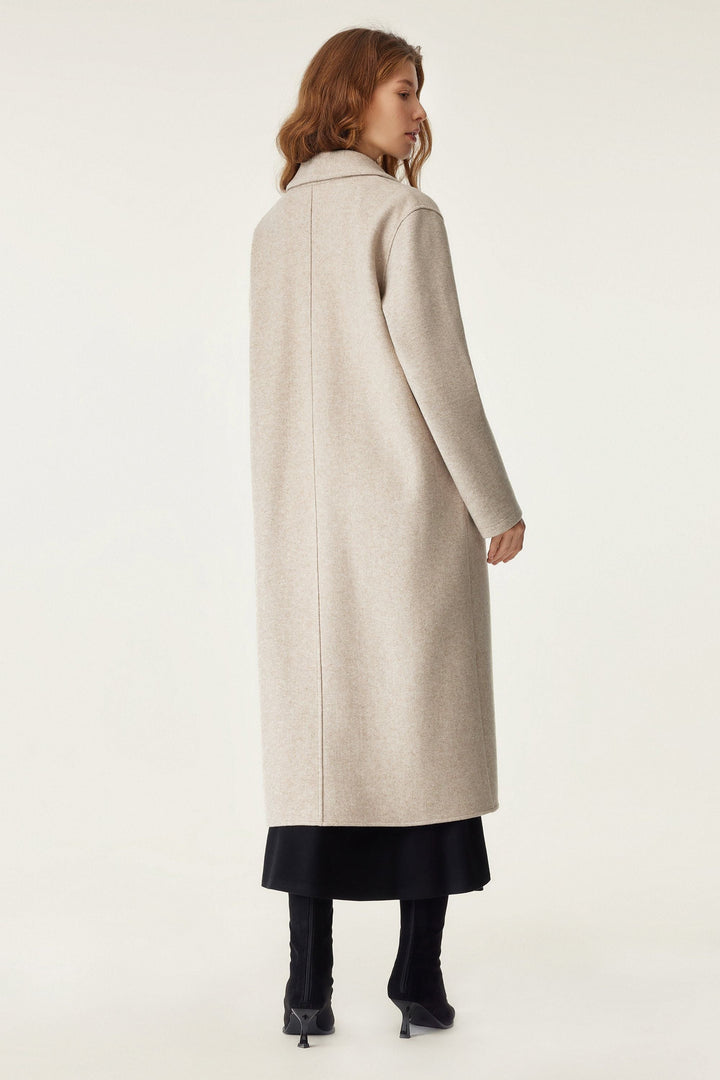 Long coat with applied pockets