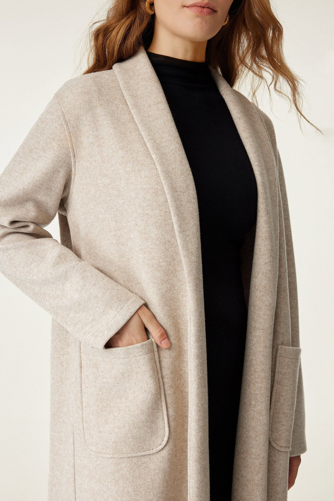 Long coat with applied pockets