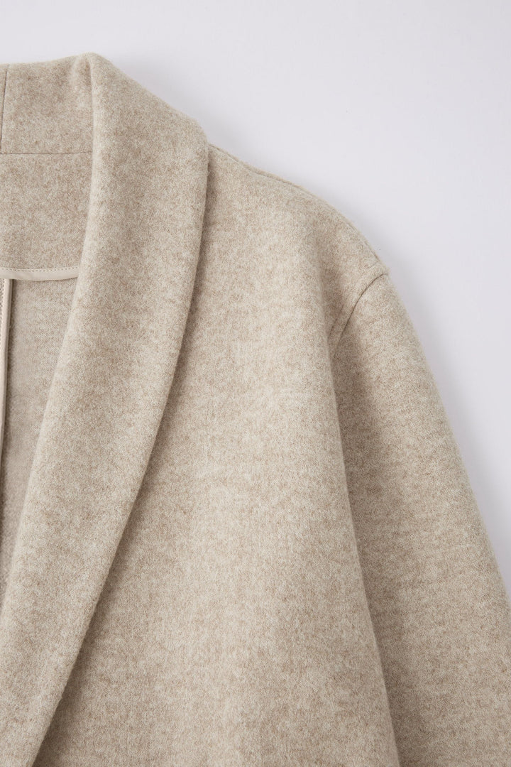 Long coat with applied pockets